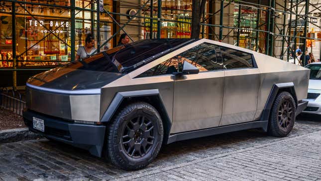 A photo of a Tesla Cybertruck parked on the street. 