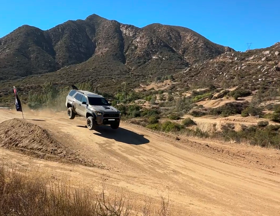SUV off-roading on dirt trail