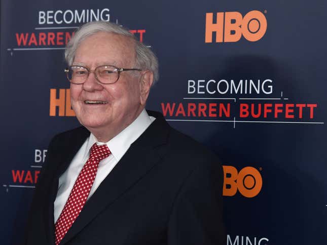 Warren Buffett on a red carpet in front of an HBO backdrop that says
