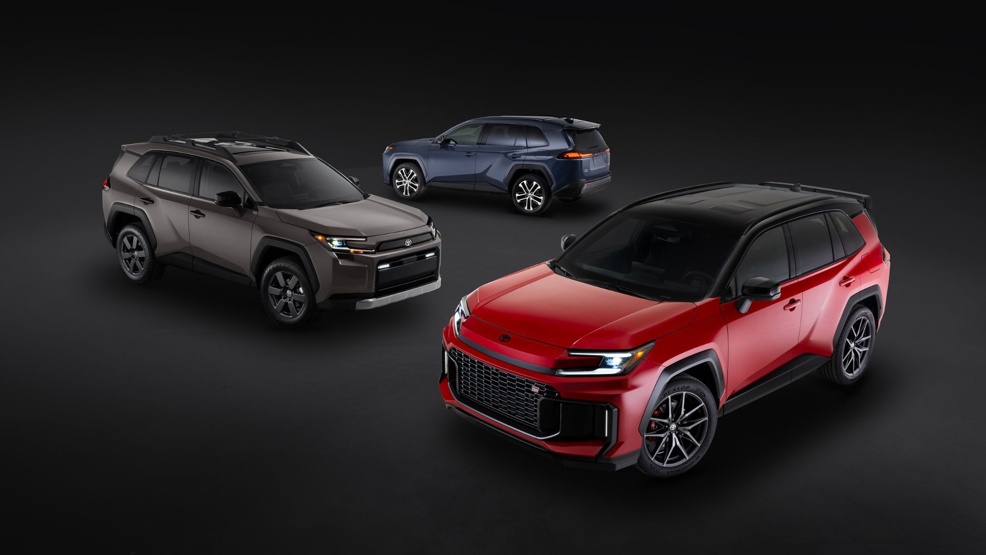 Shot of the 2026 Toyota RAV4 family in a studio with a black and gray backdrop.