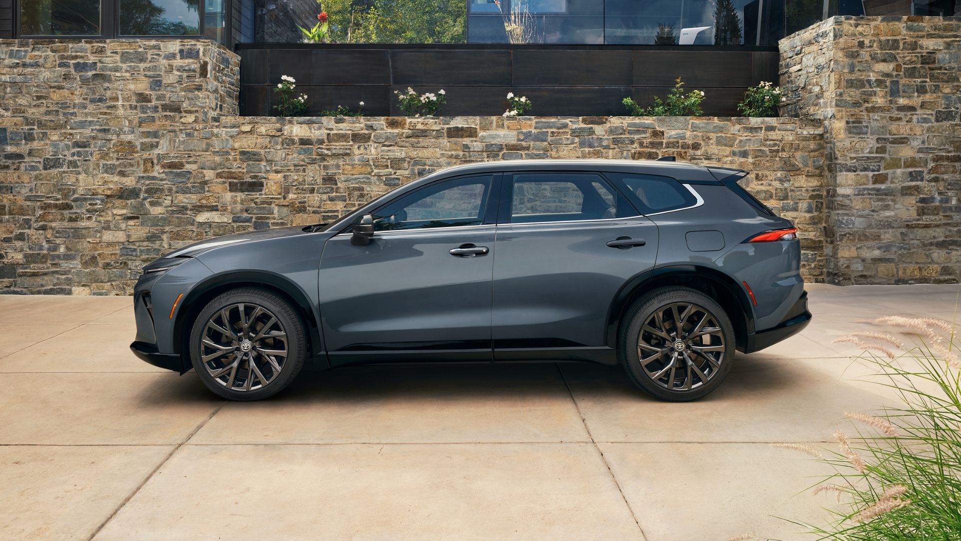 Static side profile shot of a gray 2025 Toyota Crown Signia.