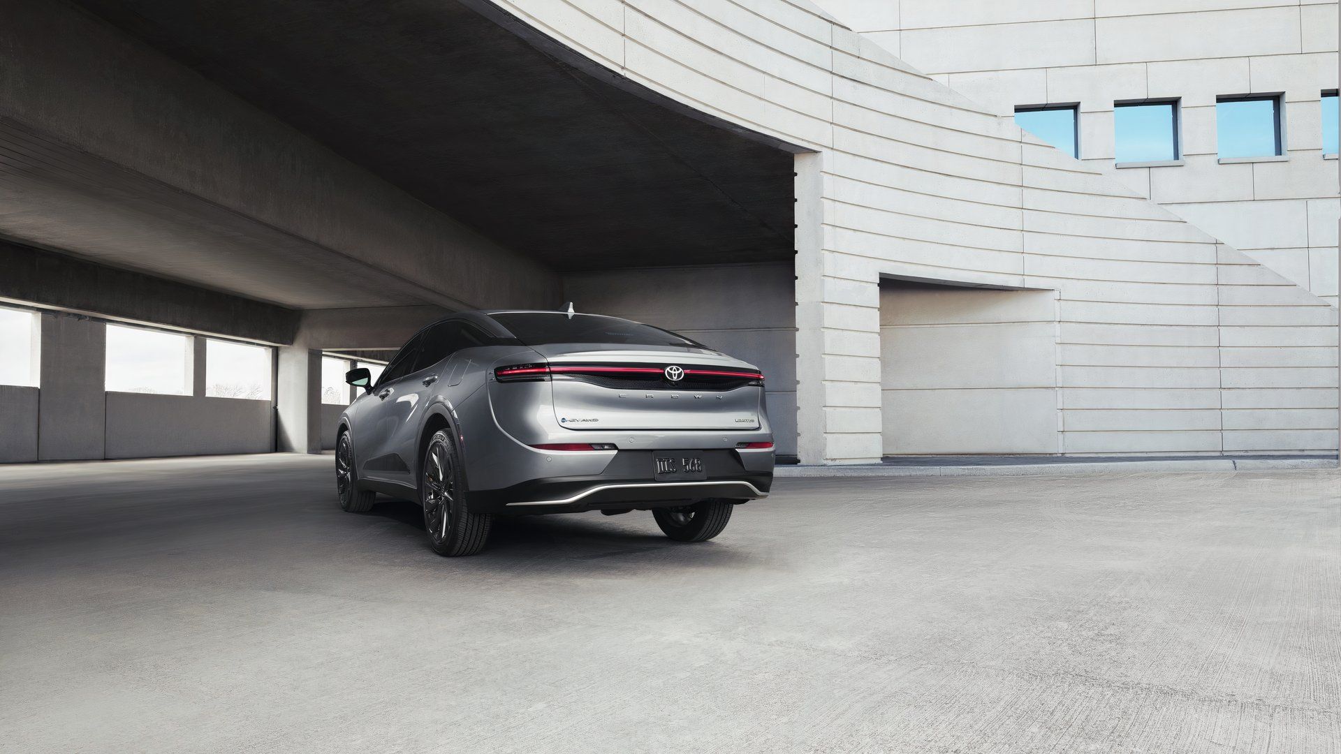 Static rear 3/4 shot of a gray 2026 Toyota Crown.