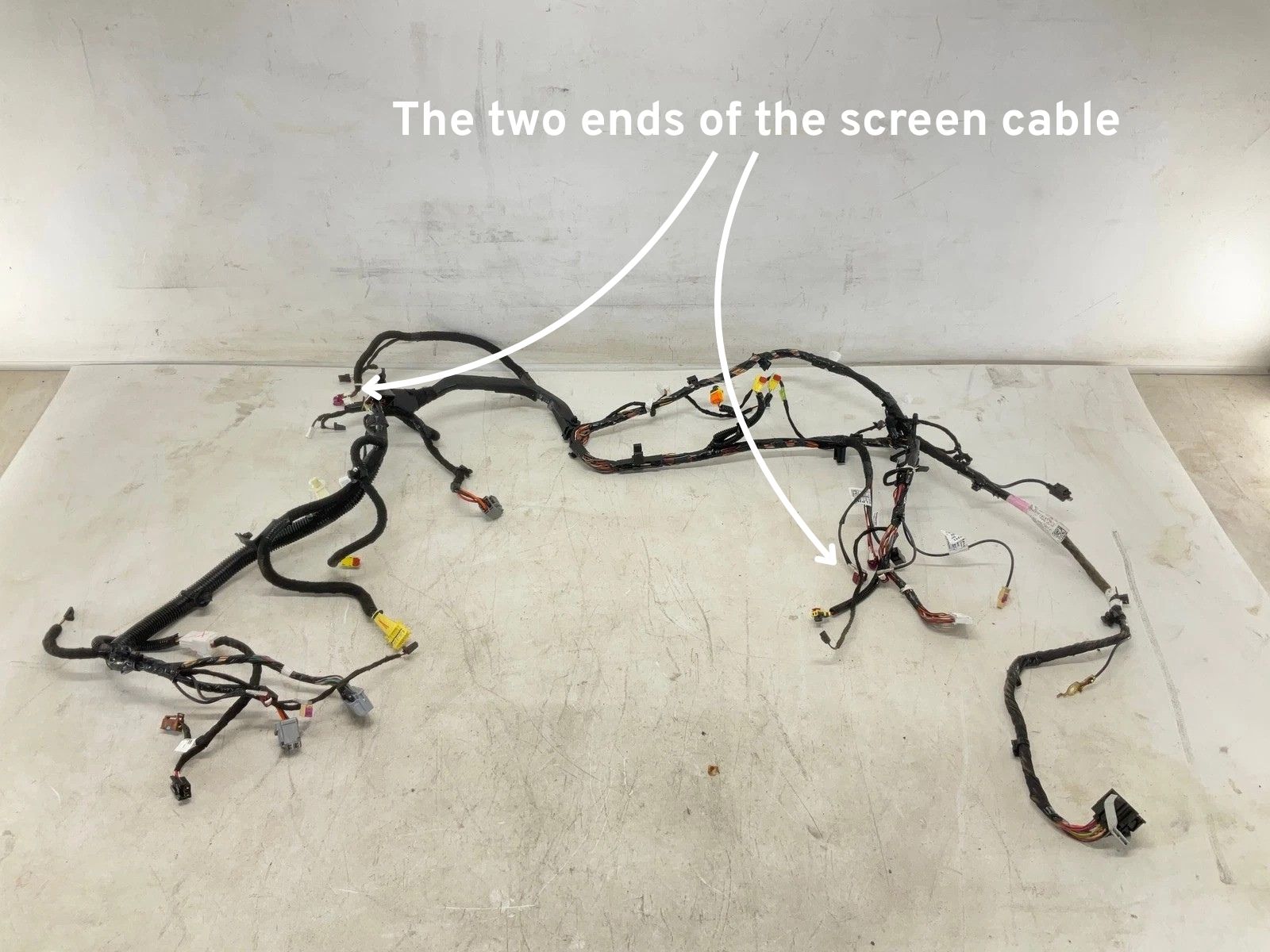 Tesla Model 3 dashboard wiring harness listed on eBay, showing a large bundle of cables
