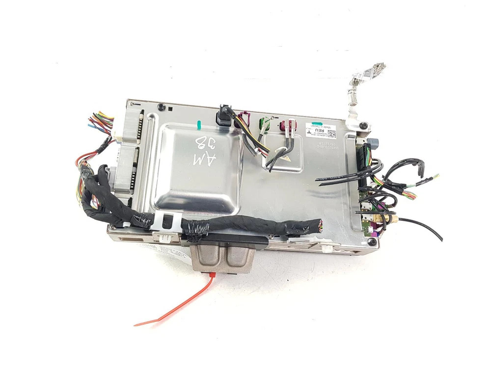 The Tesla Model 3 MCU and autopilot computer in its water-cooled metal casing