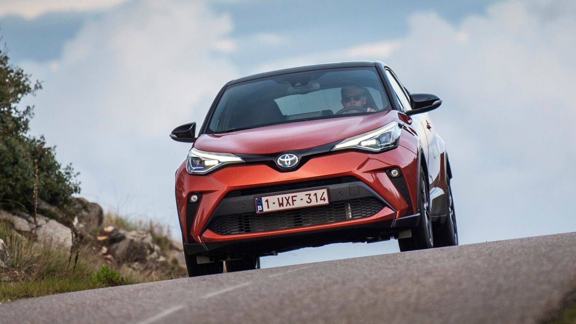 Dynamic front-end shot of an orange 2020 Toyota C-HR.