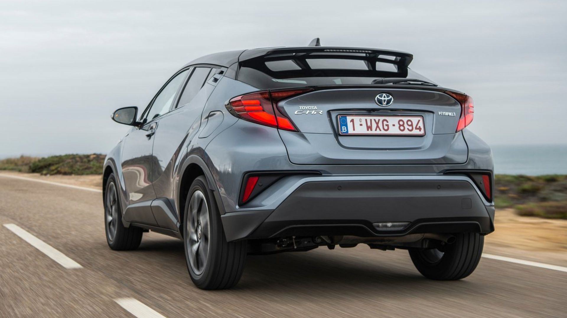 Dynamic rear 3/4 shot of a gray 2020 Toyota C-HR.
