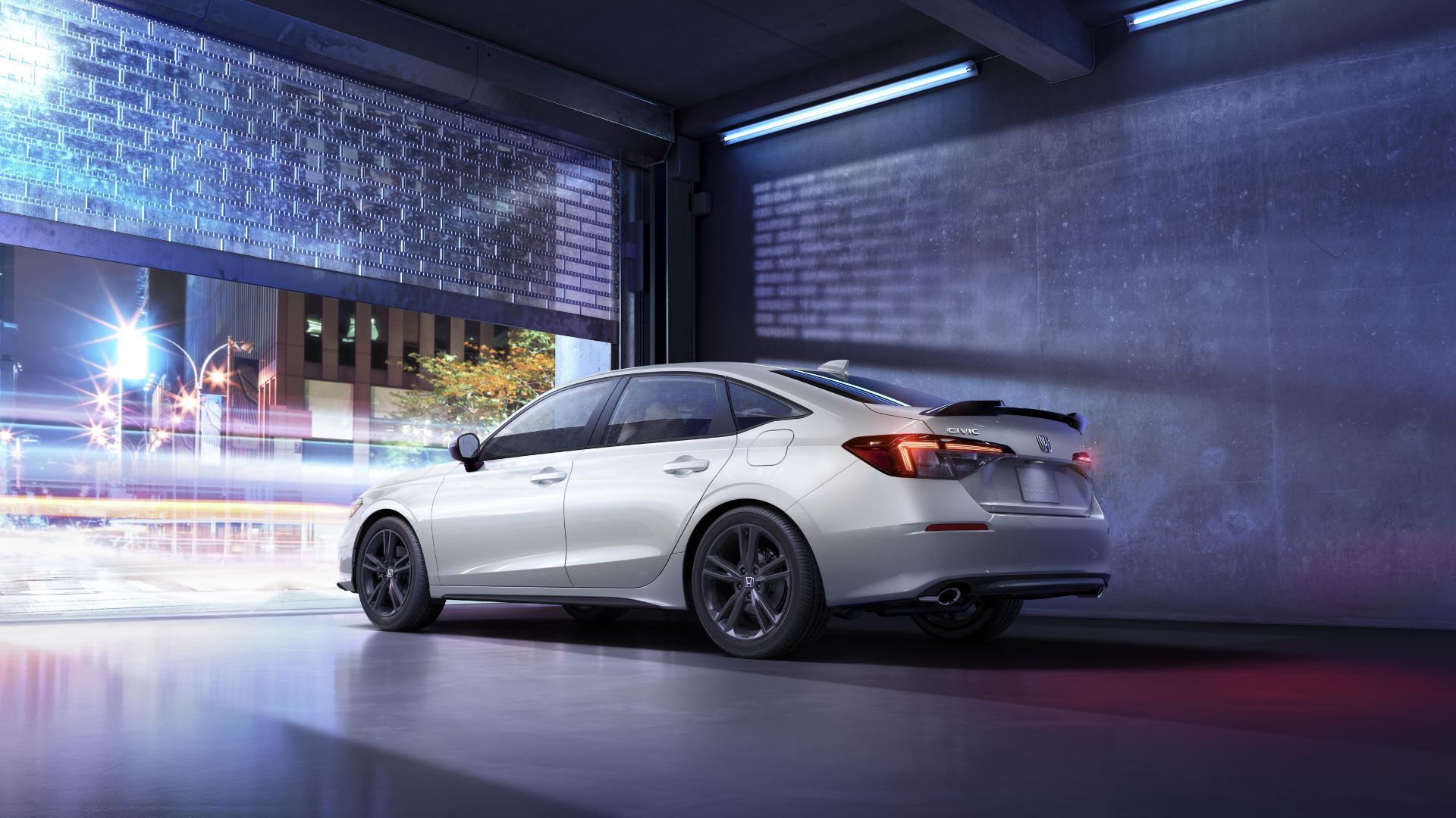 Static rear 3/4 shot of a white 2025 Honda Civic Si.