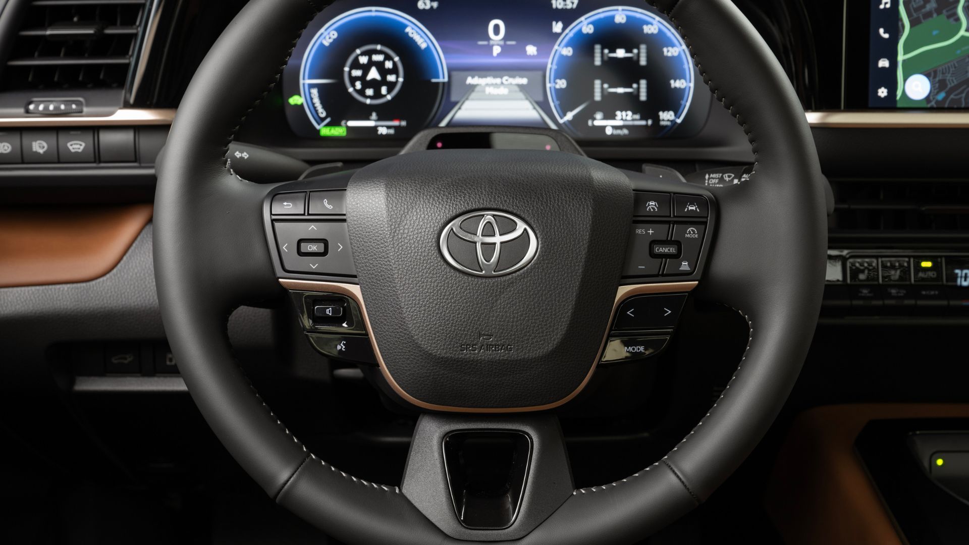 Close-up shot of the steering wheel and digital gauge cluster in the 2025 Toyota Crown Signia Limited.