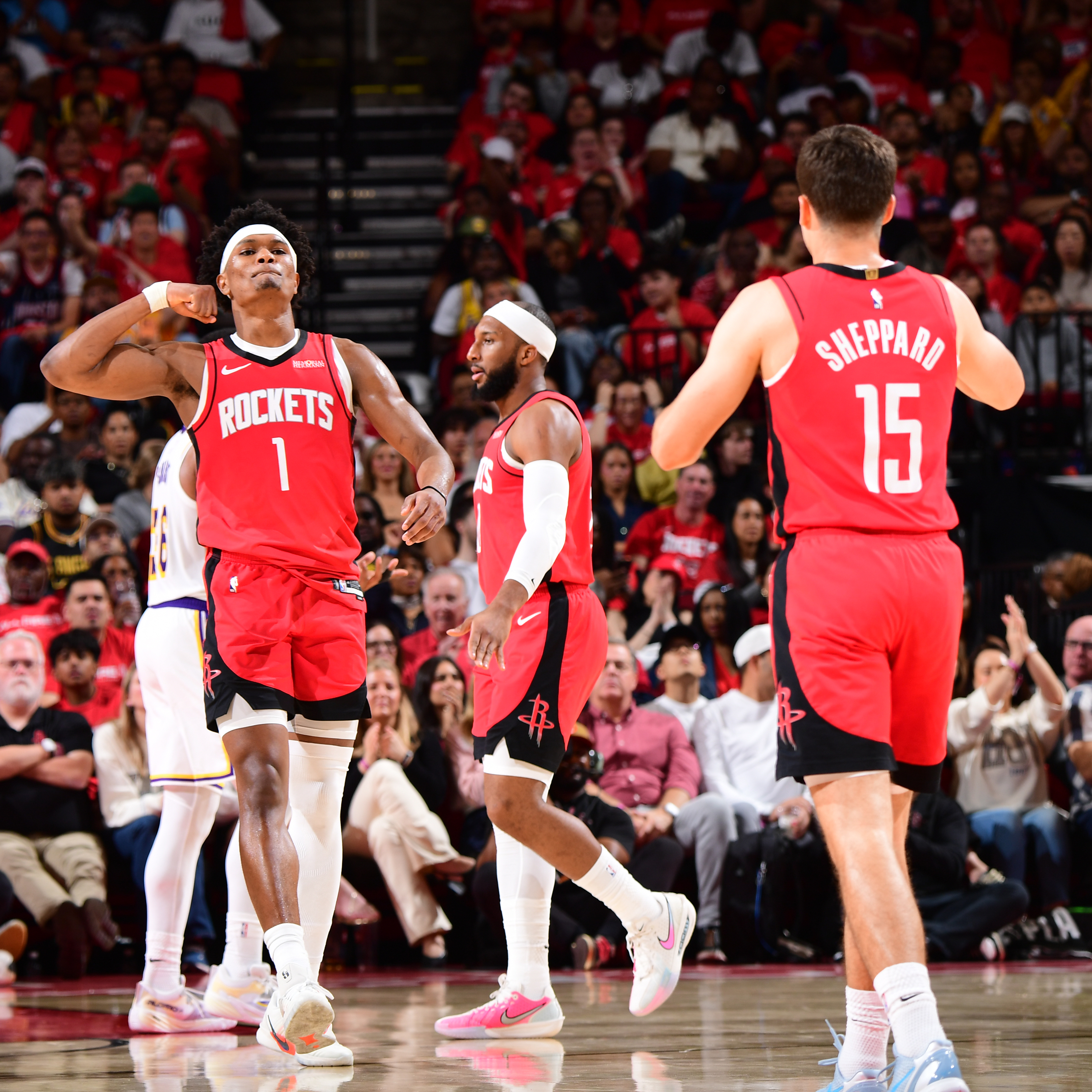 Amen Thompson and Reed Sheppard of the Houston Rockets reacting during a game.