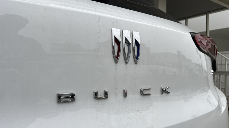 Close-up of the Buick logo on the back of a white vehicle